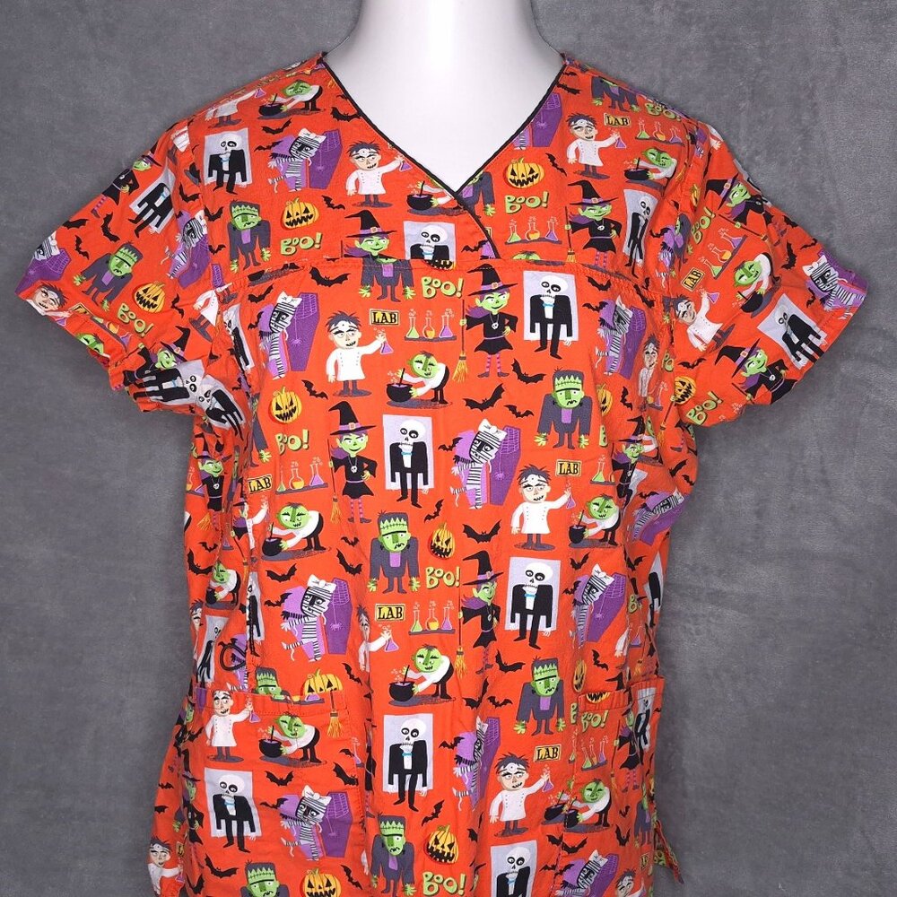 Halloween-Themed ScrubStar Womens Scrub Top L Orange Cartoon Monsters Print